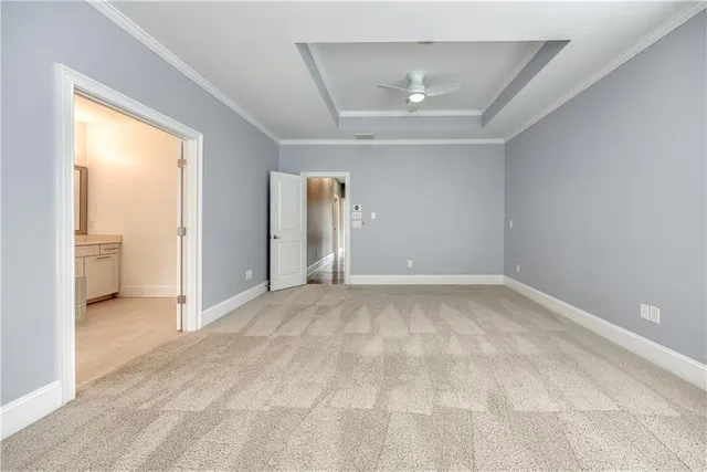 a spacious bathroom with a bathtub sink and mirror