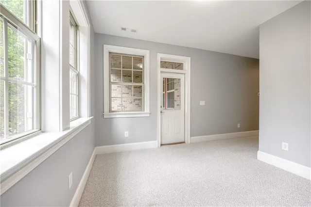 a view of balcony with wooden floor