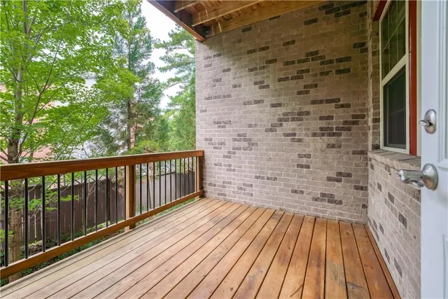 a view of balcony with wooden floor
