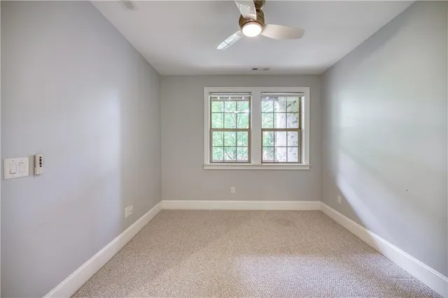 a bathroom with a toilet a sink and a mirror