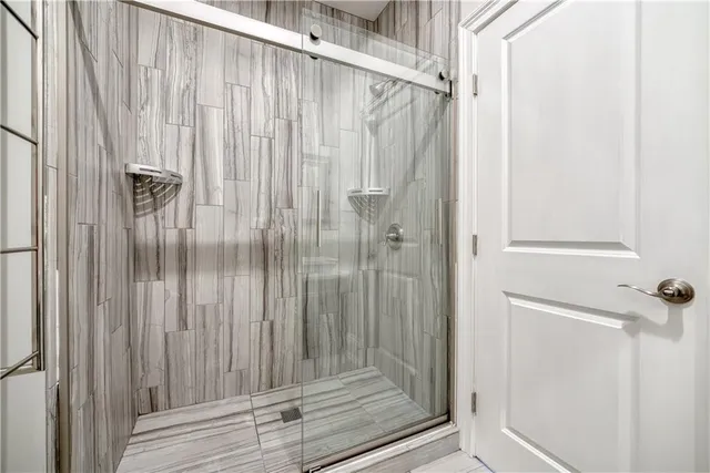 a view of a brick house with many windows