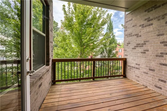 a view of balcony and wooden floor