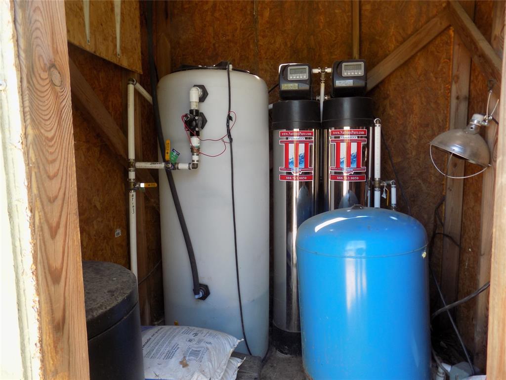 12792 Highway 199 Poolville, TX 76487 - Photo 9 of 24 Well house has an enclosed water purifier softener system