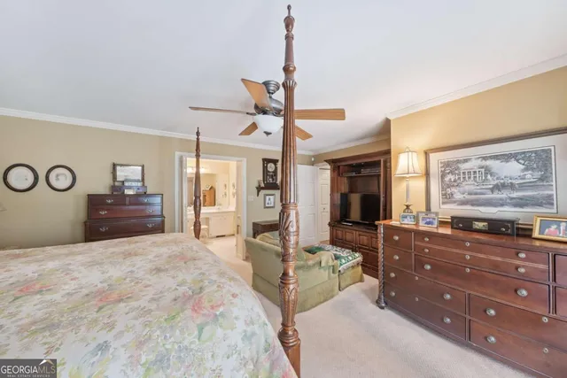 a bedroom with a large bed and a dresser