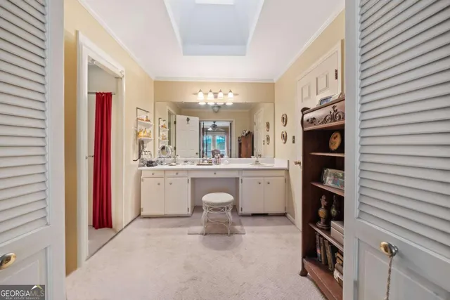 a bathroom with a sink vanity and mirror