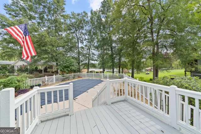 a view of balcony with furniture and trees