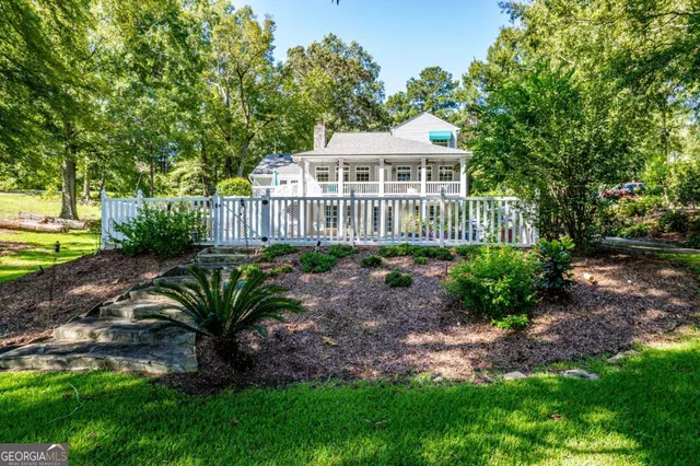 a view of a house with a garden