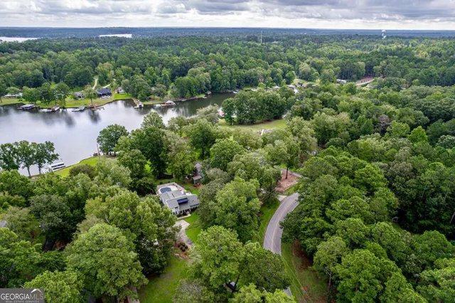 a view of a lake with houses in the back
