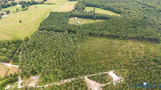 a view of a back yard of a house with a yard