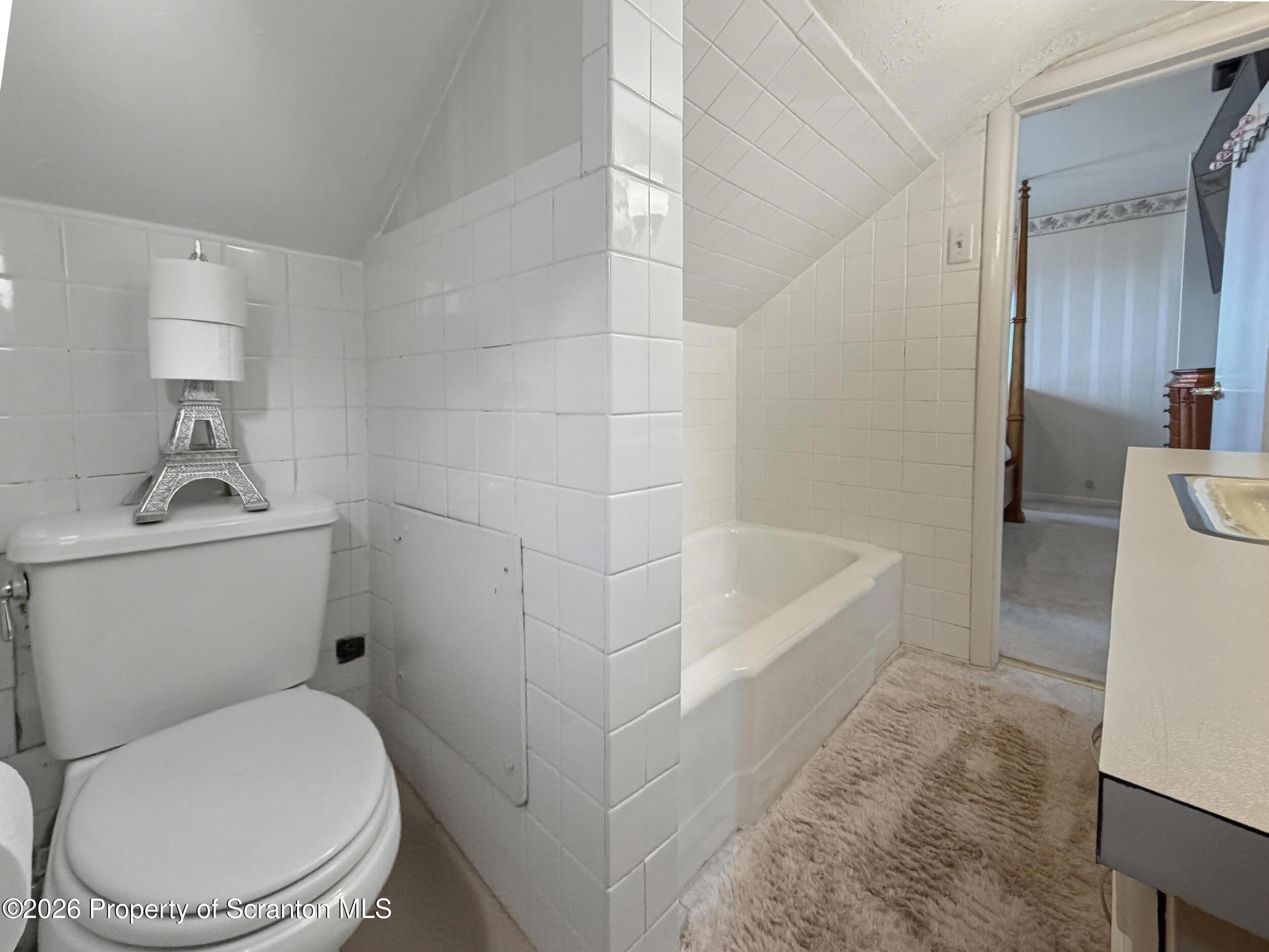 143 Old Boston Road Pittston, PA 18640 - Photo 28 of 61 a white toilet sitting next to a bath tub