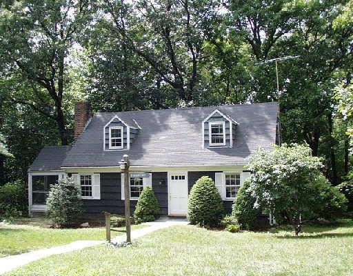 12 Great Hill Road Darien, CT 06820 - Photo 1 of 1 front view of a house with a yard
