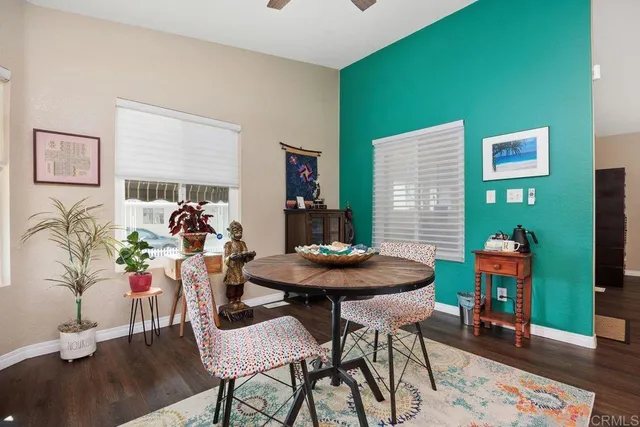 a view of a livingroom with furniture and wooden floor