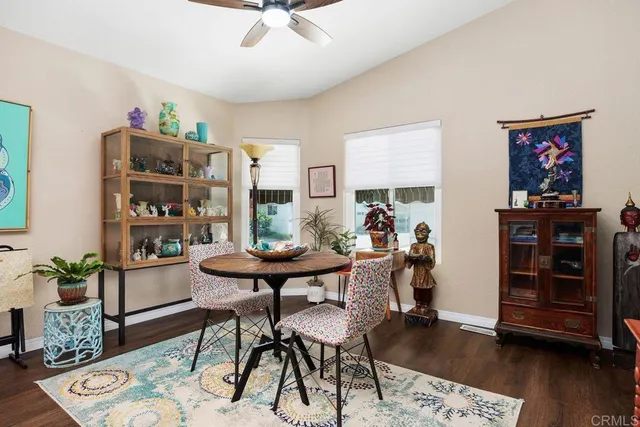 a kitchen with cabinets and a wooden floor