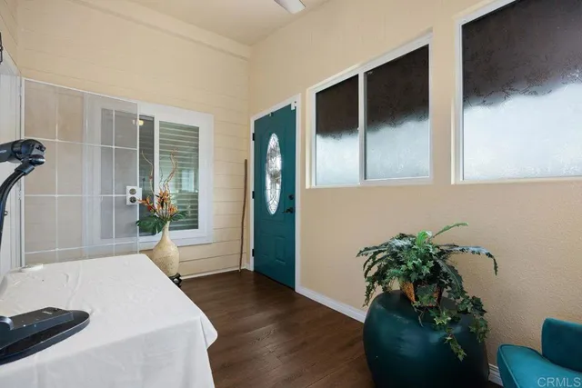 a spacious bedroom with a bed and a large mirror