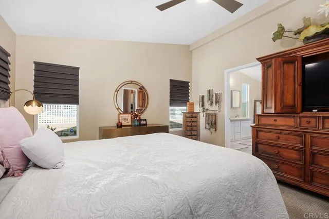 a bedroom with bed and window