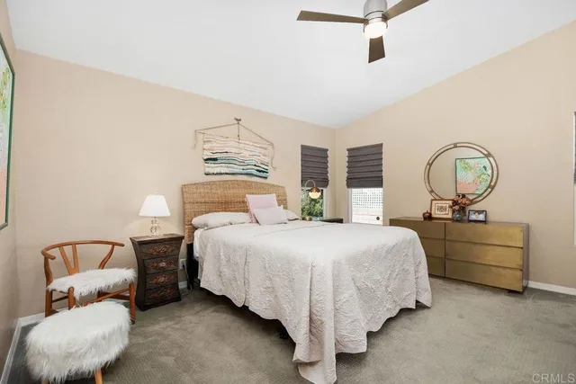 a en suite bathroom with a double vanity sink and a mirror