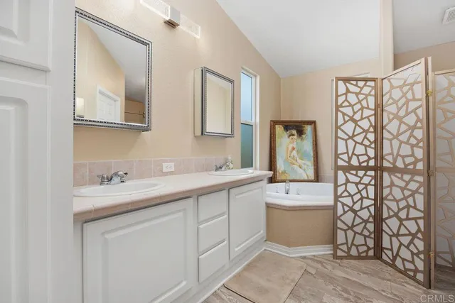 a white bath tub sitting next to a window