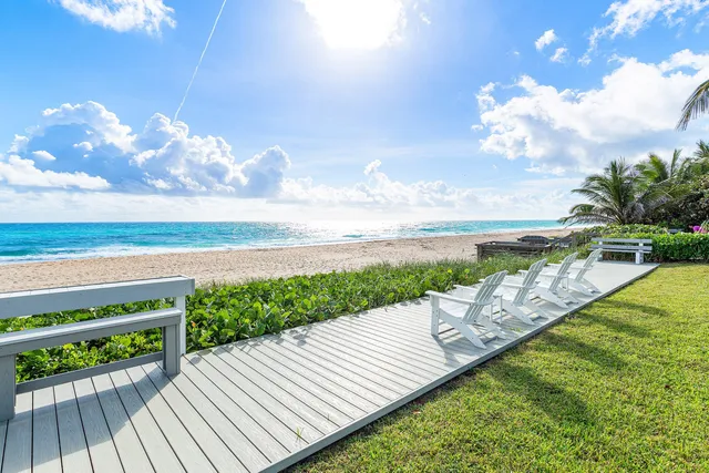 a view of a swimming pool with a yard