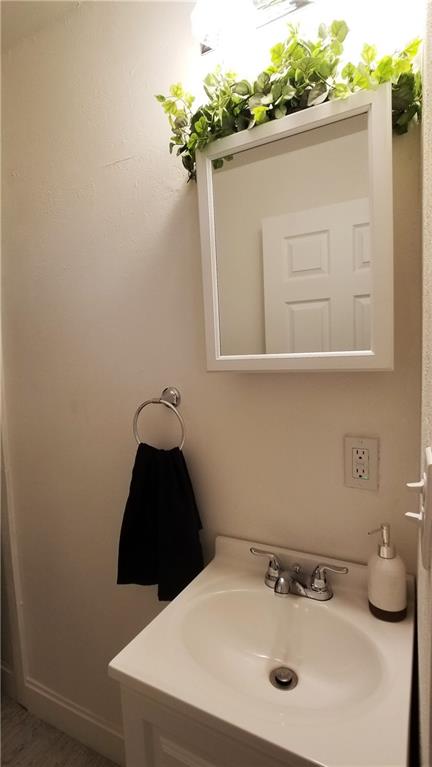 428 East Washington Street Rochester, PA 15074 - Photo 11 of 25 a bathroom with a sink and a mirror