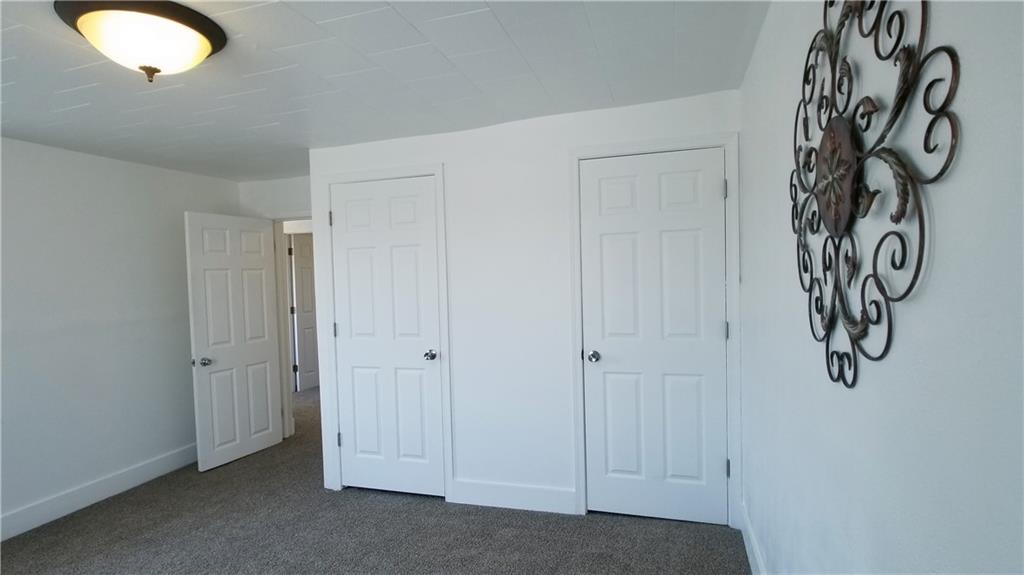 428 East Washington Street Rochester, PA 15074 - Photo 15 of 25 a view of a closet with white wooden cabinets