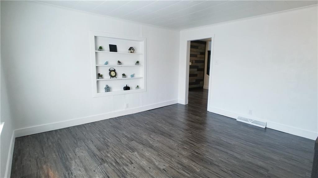 428 East Washington Street Rochester, PA 15074 - Photo 8 of 25 an empty room with wooden floor