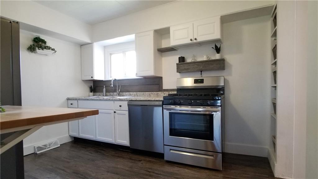 428 East Washington Street Rochester, PA 15074 - Photo 10 of 25 a kitchen with stainless steel appliances granite countertop a stove and a sink