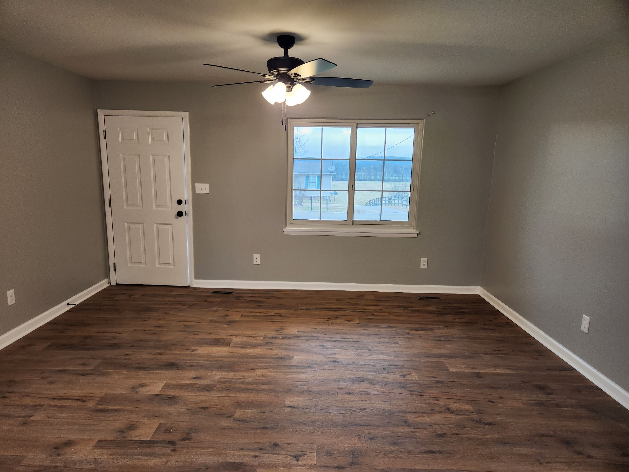 1715 Vales Mill Road Pulaski, TN 38478 - Photo 12 of 28 a view of an empty room with wooden floor and a window