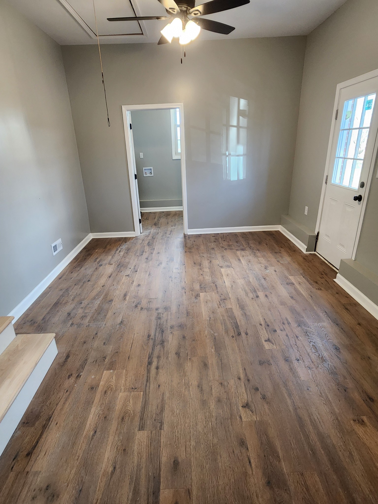 1715 Vales Mill Road Pulaski, TN 38478 - Photo 26 of 28 an empty room with wooden floor and windows