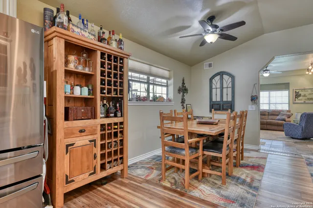 a view of a dining room with furniture and wooden floor