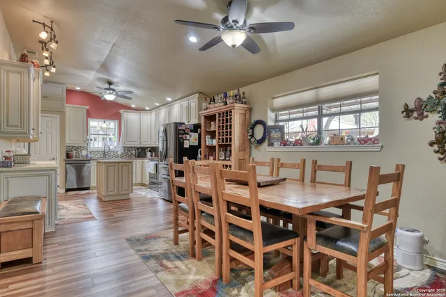 a view of a dining room with furniture window and wooden floor
