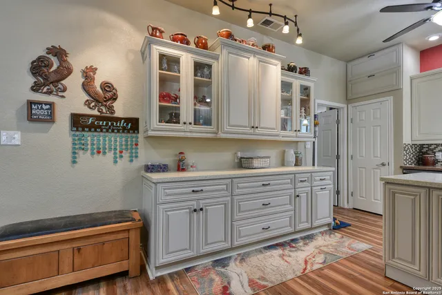 a kitchen with a sink and cabinets