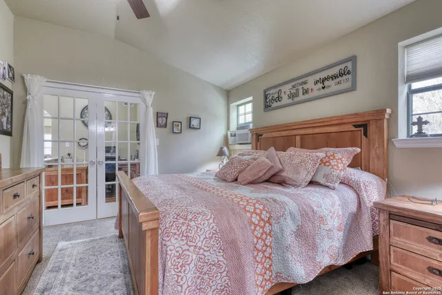 a bedroom with a large bed and a dresser