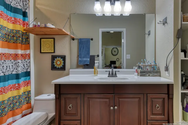 a bathroom with a sink double vanity and a mirror