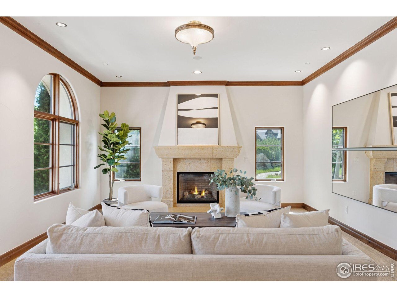 6541 Legend Ridge Trail Niwot, CO 80503 - Photo 12 of 45 a living room with furniture fireplace and window