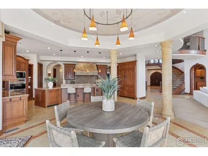a living room with furniture a wooden floor and a fireplace