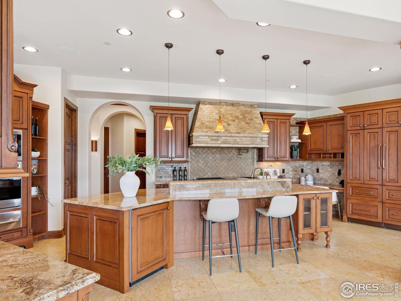 6541 Legend Ridge Trail Niwot, CO 80503 - Photo 18 of 45 a kitchen with sink a table and chairs