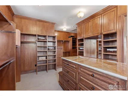 a kitchen with a refrigerator and cabinets