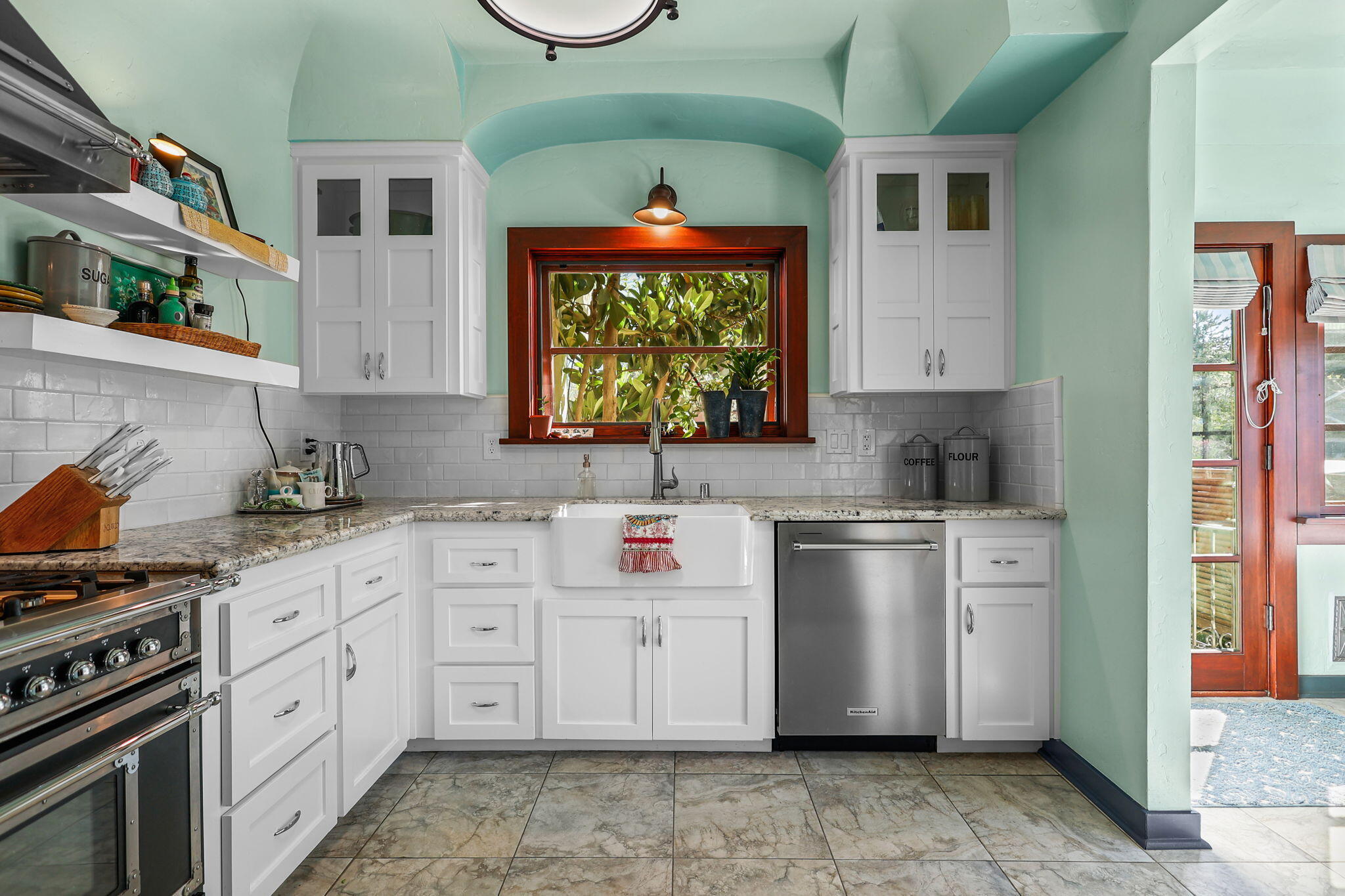 1465 Riverside Drive Redding, CA 96001 - Photo 69 of 163 a kitchen with stainless steel appliances a stove sink and cabinets