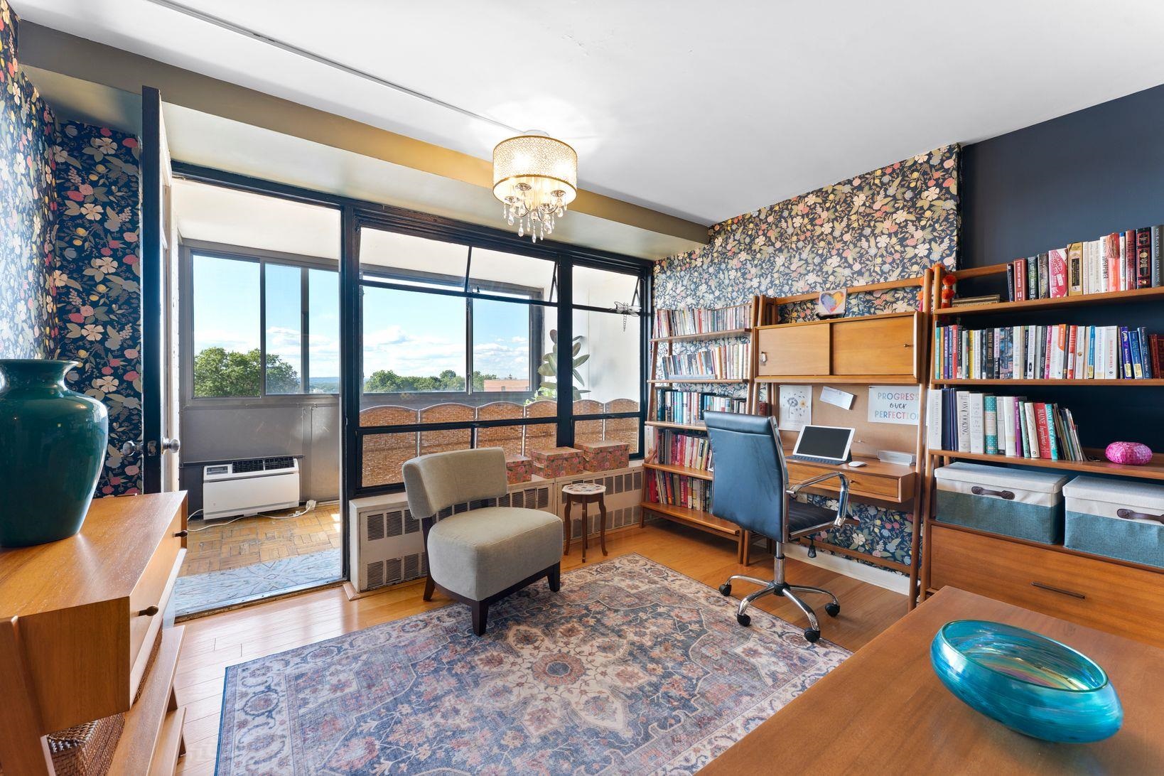 90 Prospect Avenue, Unit 9B Hackensack, NJ 07601 - Photo 4 of 12 a living room with furniture a rug and a large window