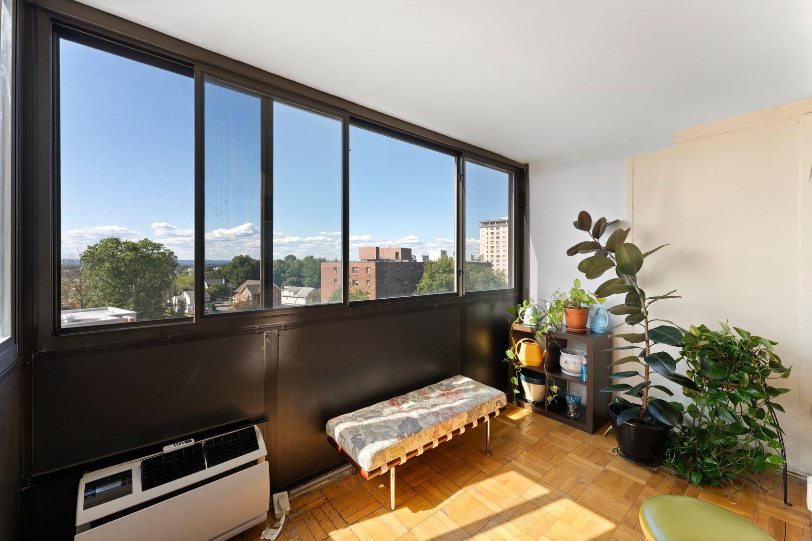 90 Prospect Avenue, Unit 9B Hackensack, NJ 07601 - Photo 5 of 12 a room with furniture and a window