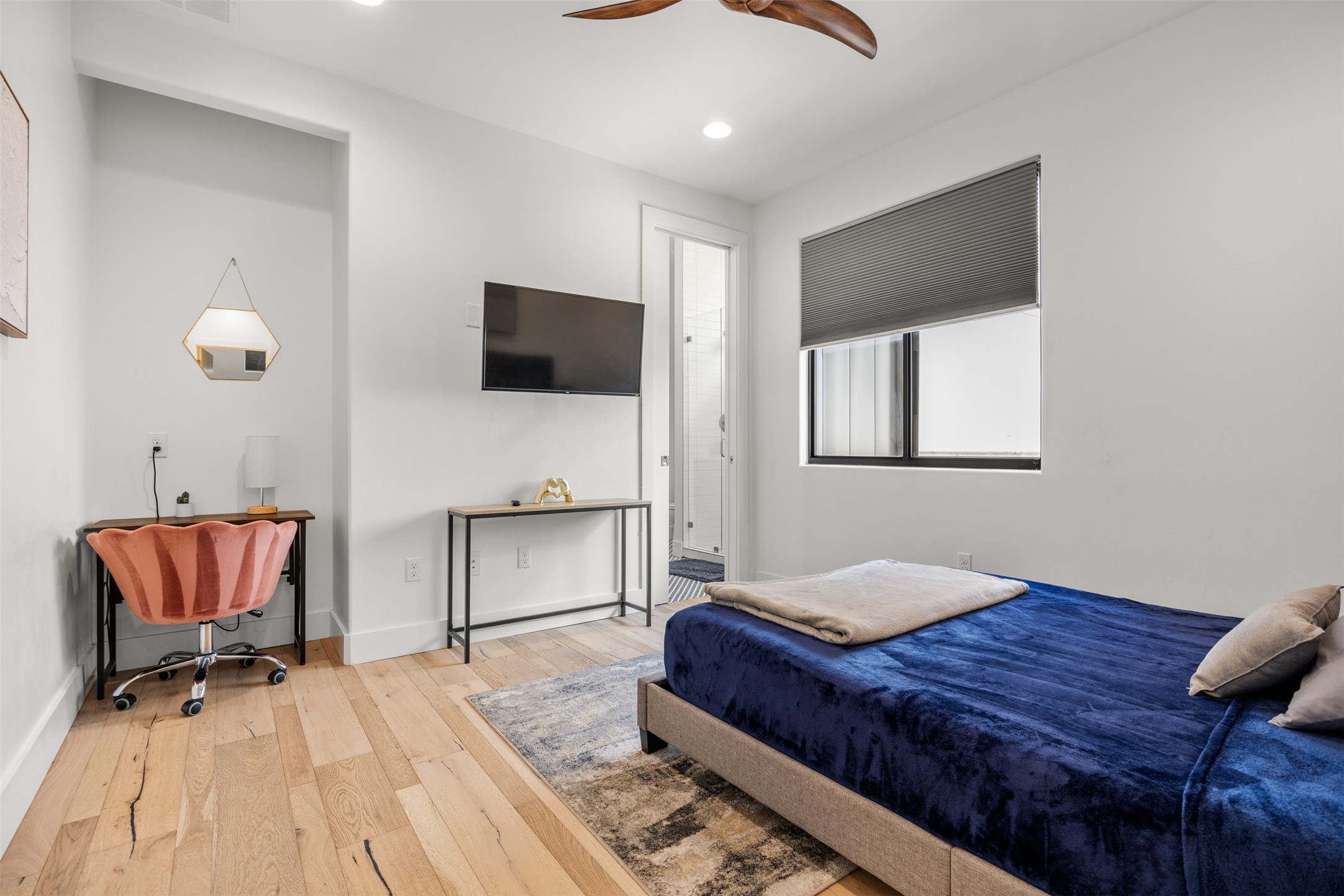 4103 Ridgelea Drive Austin, TX 78731 - Photo 17 of 26 Hardwood floors and a large window define this comfortable bedroom.