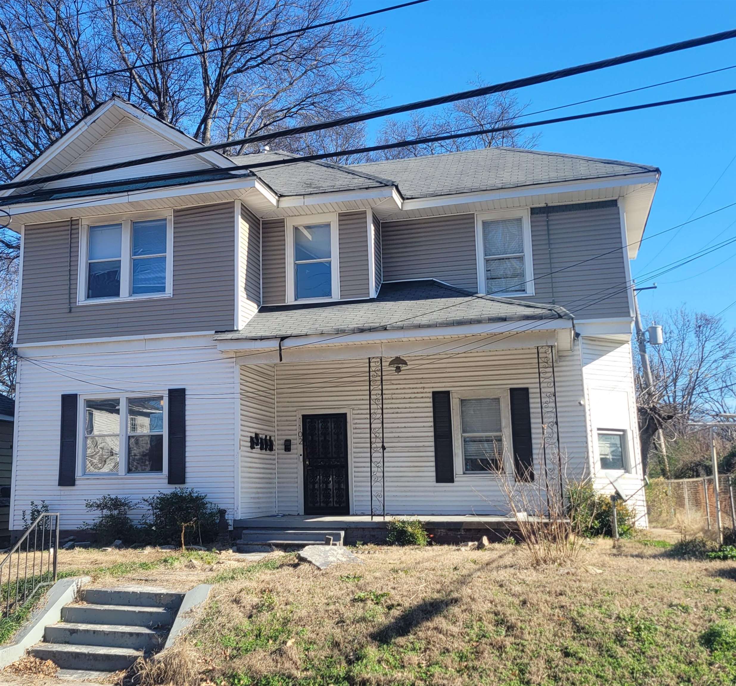 1102 South Somerville Street Memphis, TN 38106 - Photo 1 of 1 View of front of property featuring a porch and a shingled roof