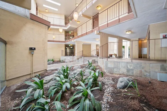 a view of a lobby with black carpet