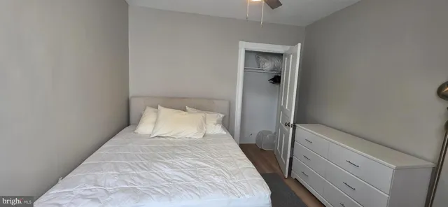 a bed room with a bed and a night stand