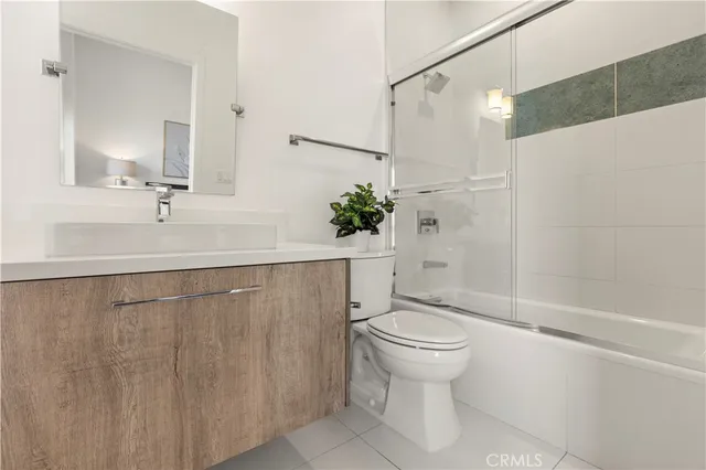 a living room with furniture and a clock