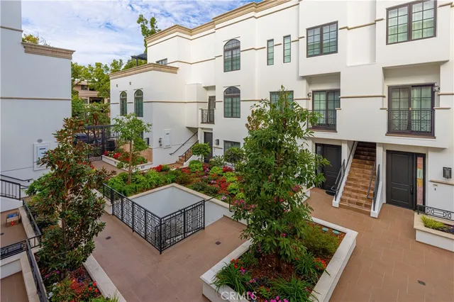 a kitchen with stainless steel appliances kitchen island granite countertop a sink and cabinets
