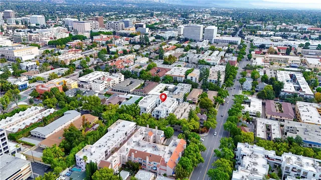 an aerial view of residential houses with outdoor space