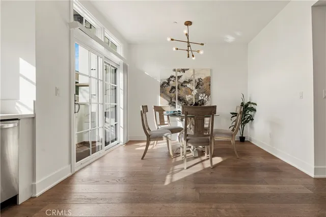 a kitchen with a refrigerator sink and cabinets