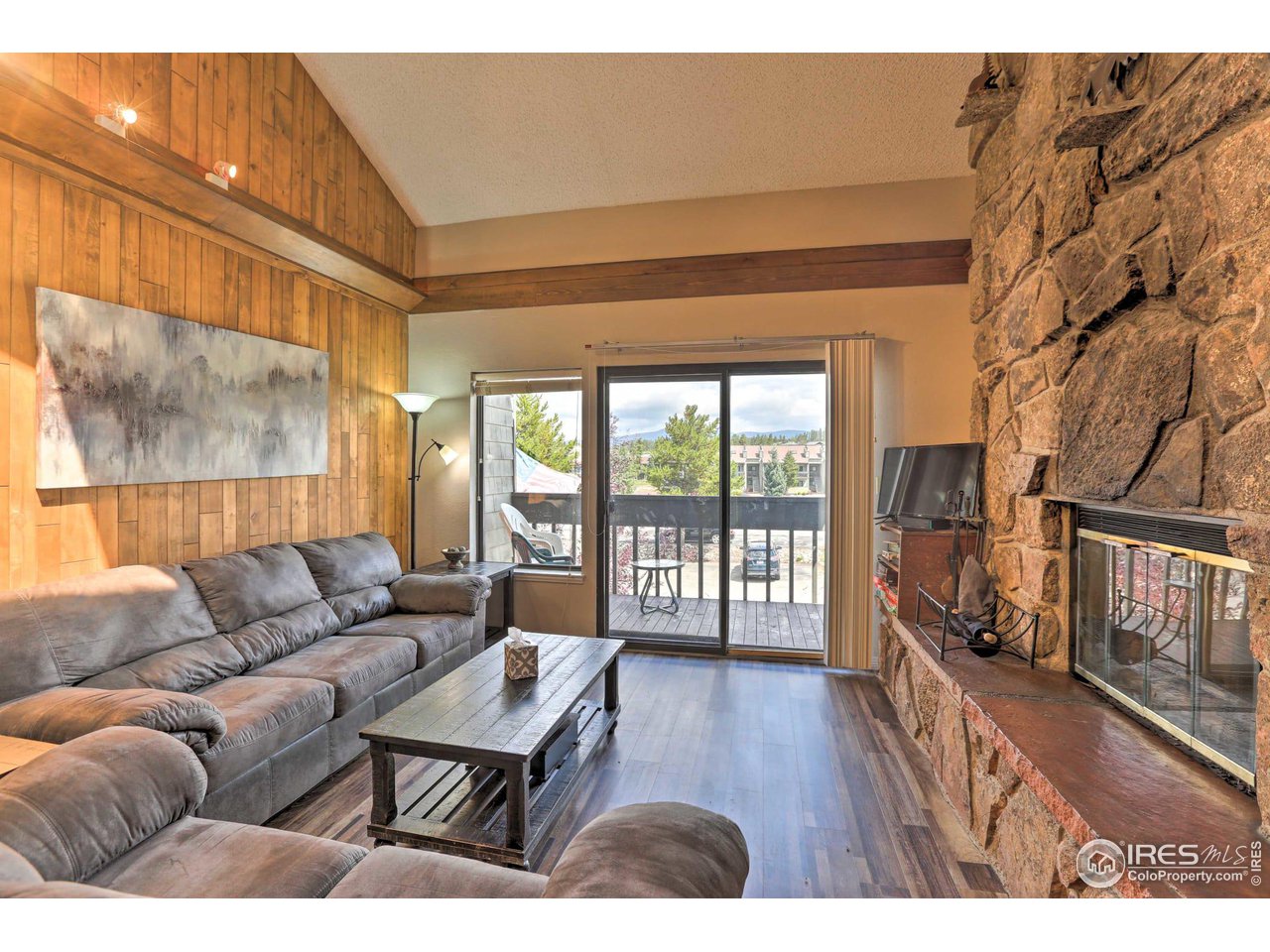 83 County Road, Unit A9 Fraser, CO 80442 - Photo 2 of 23 a living room with furniture and a floor to ceiling window