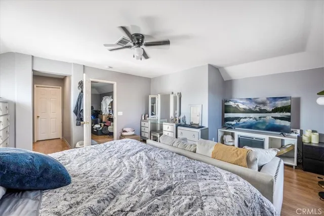 a bed room with a bed and a large mirror